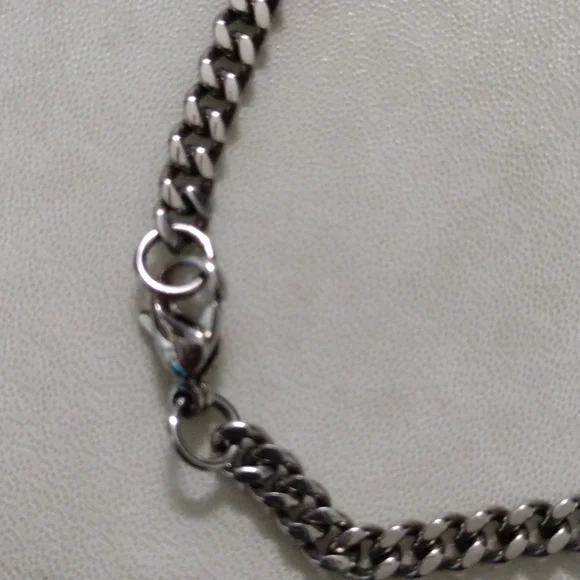 Chisel stainless steel skull pendant and chain necklace.